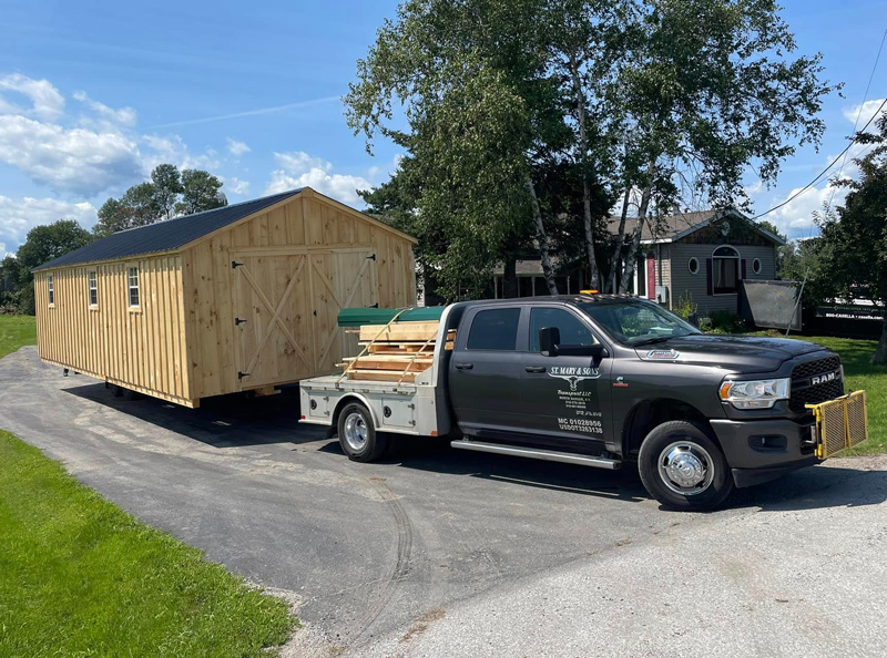 St Mary & Sons Transport Truck delivering a wood shed