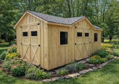 Amish shed with shingle roof and barn-style doors