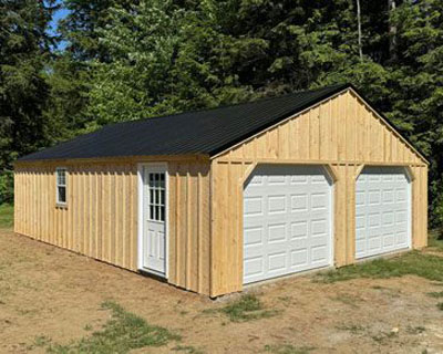 Amish built two car garage with side door and window