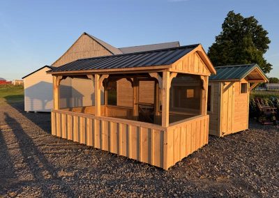 Amish pavilion with screened sides and wood posts