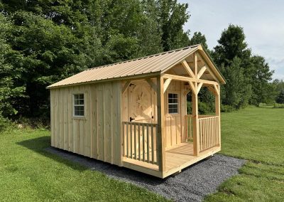 Amish cabin with wood siding, single door and double windows