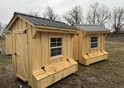 Small Amish chicken coops with black roof, windows and nesting boxes
