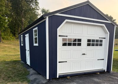 Blue with white trim storage shed