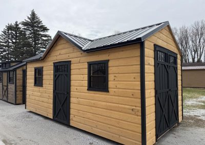 Amish shed with black roof, black trim and double doors on the side