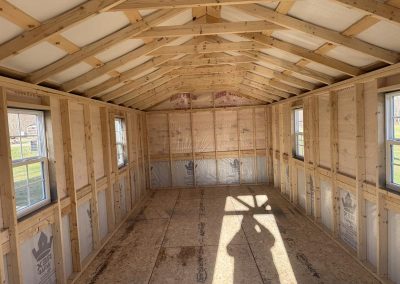 Interior of an Amish-built structure showing exposed wood roof framing