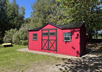 Red with black trim and roof storage shed