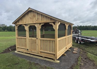 Amish pavilion with wood posts and screened walls
