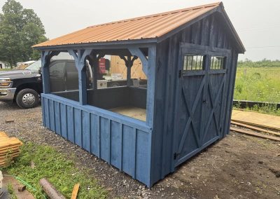Amish pavilion with dark blue trim and 3 open sides