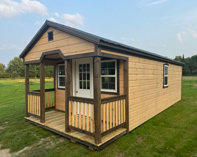 Amish Built Camp with a small porch and dark trim