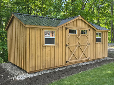 Recently installed board and batten shed with a black metal roof