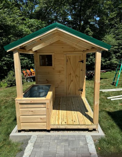 Amish built wood sauna with outdoor cold plunge on the covered porch